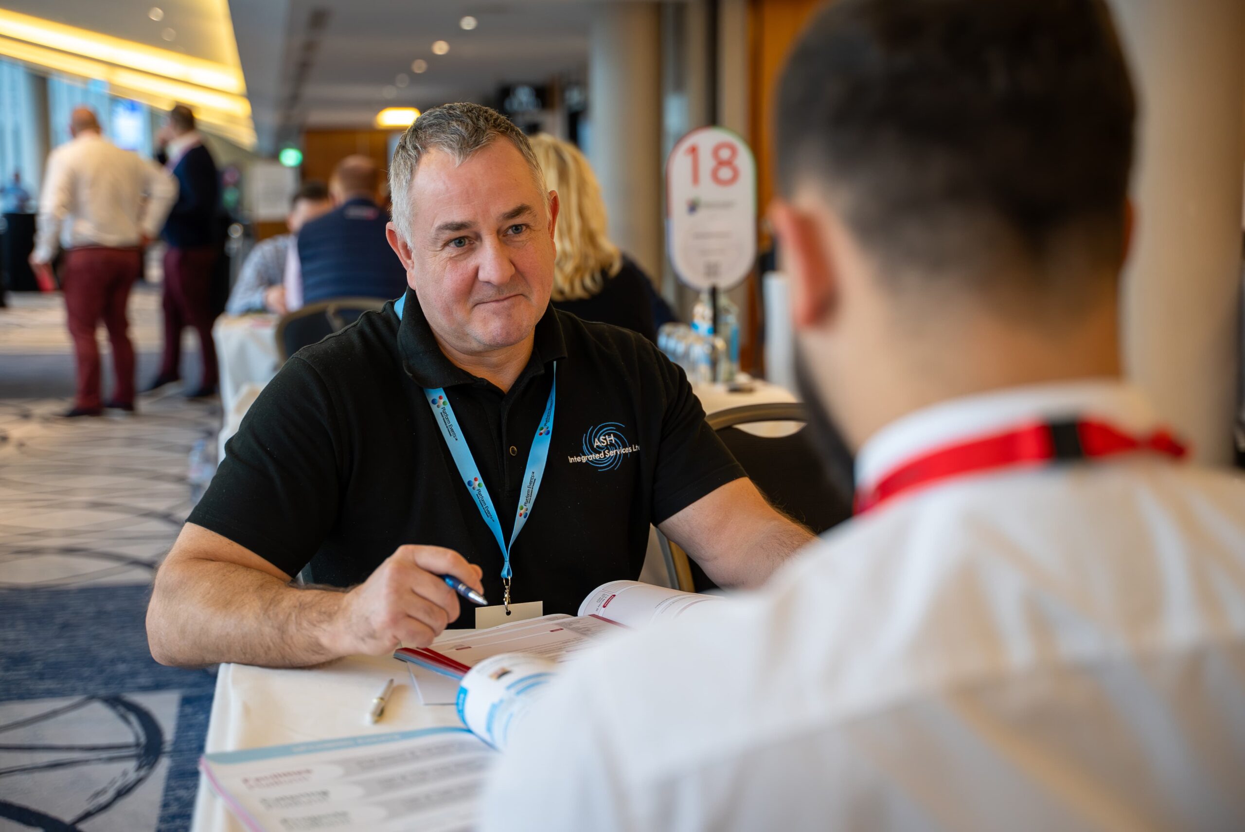 buyer and supplier in focused meeting